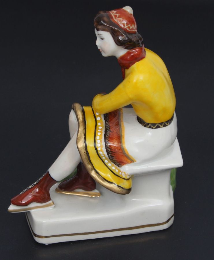 Antique Porcelain figurine ``Girl with skates``