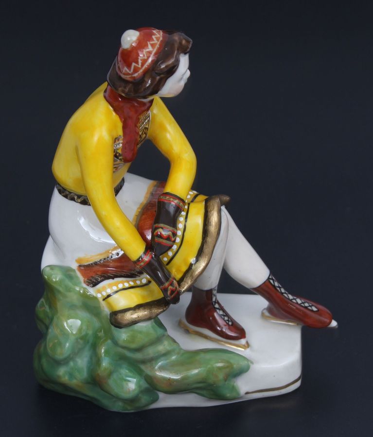 Antique Porcelain figurine ``Girl with skates``