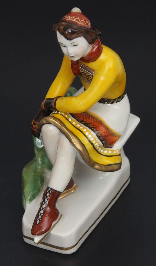 Antique Porcelain figurine ``Girl with skates``