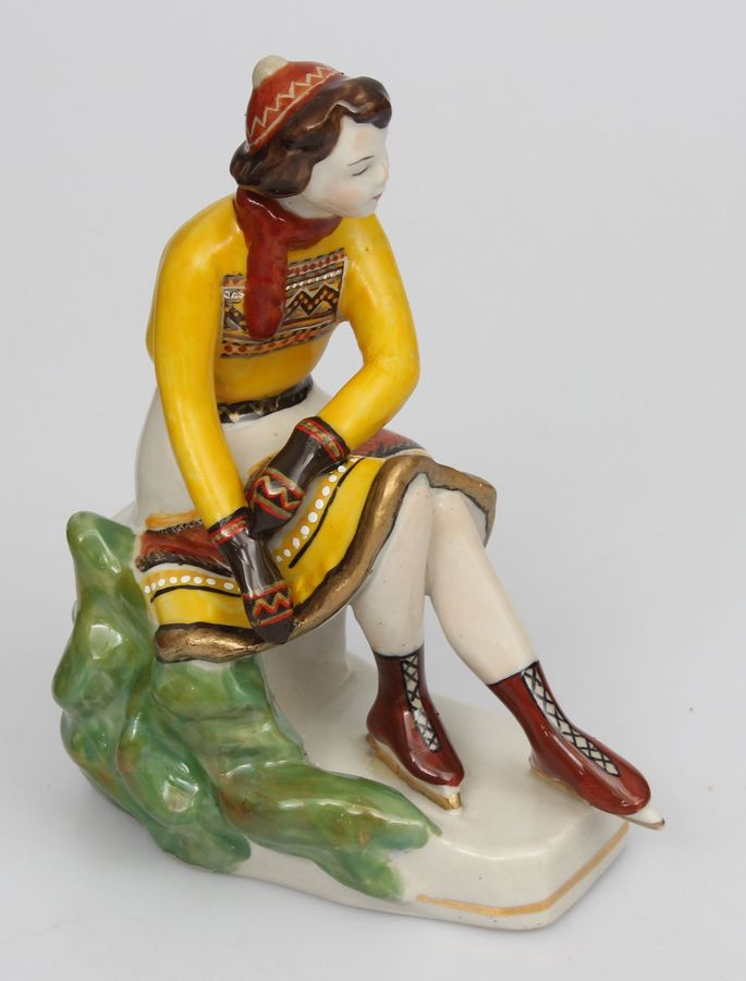 Antique Porcelain figurine ``Girl with skates``