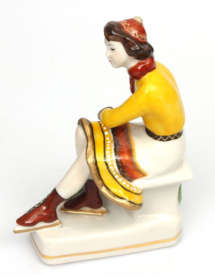 Antique Porcelain figurine ``Girl with skates``