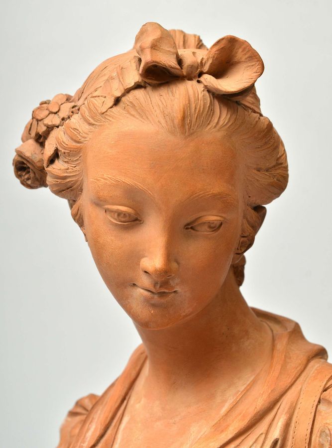 Antique Terracotta bust on a marble base Bust of a Virgin