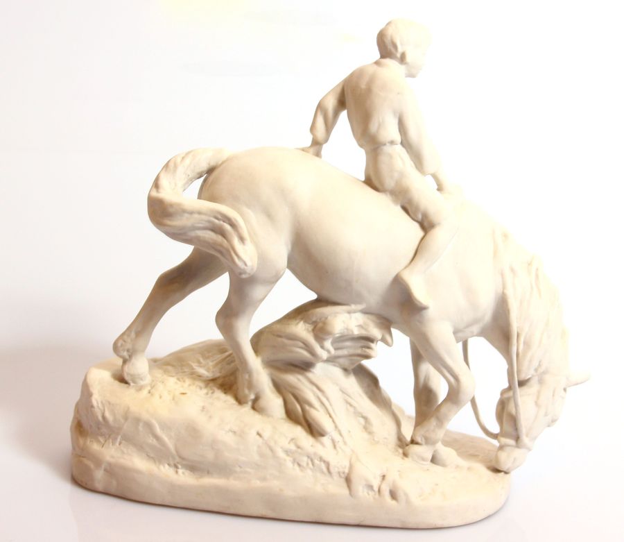 Antique Biscuit figurine Boy on a horse