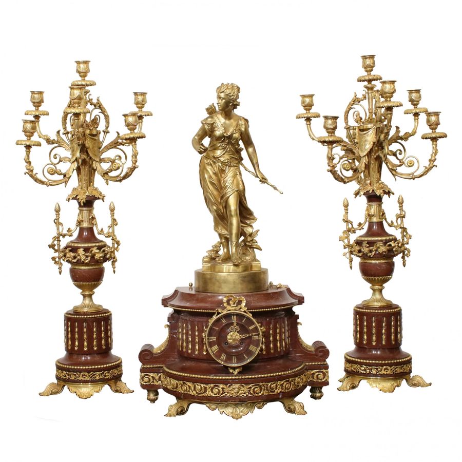 Antique Bronze fireplace clock set with candelabra.