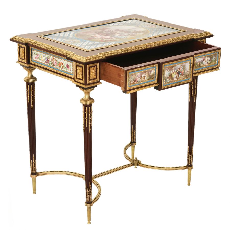 Antique A magnificent ladies table with gilded bronze decor and porcelain panels in the style of Adam Weisweiler. France. 19th century