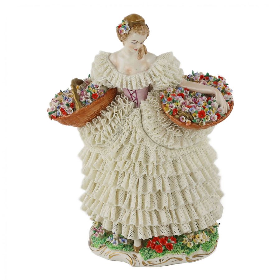 Antique Sitzendorf Porcelain. Porcelain figurine of the Flower Girl. 20th century.