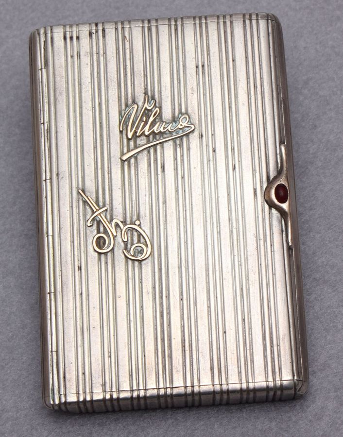 Silver cigarette holder with gold inlays