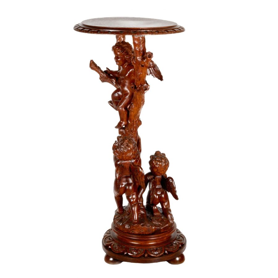 Antique Wooden console with carved cupids.