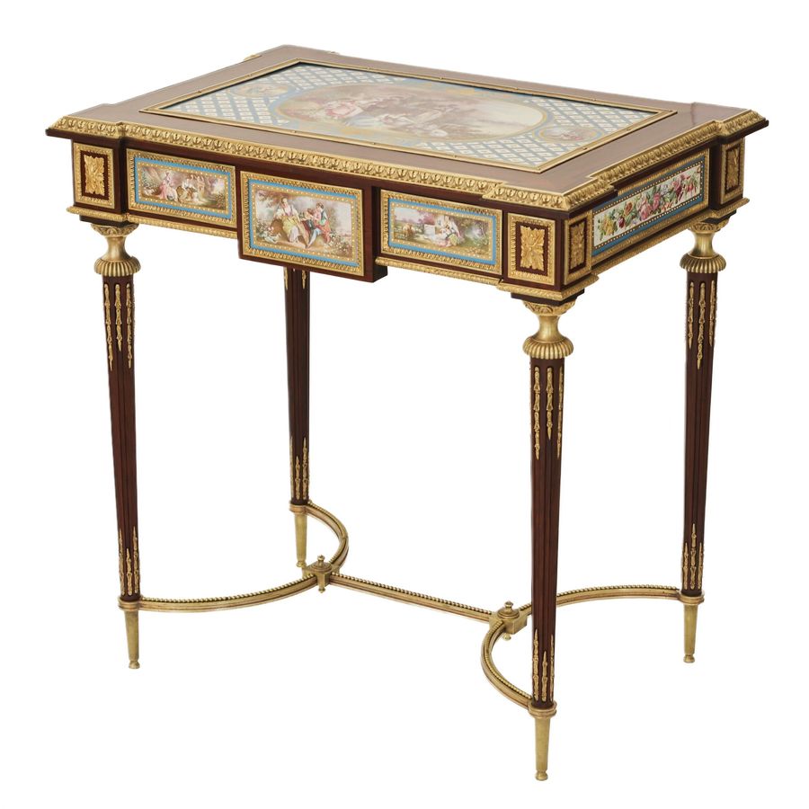 Antique A magnificent ladies table with gilded bronze decor and porcelain panels in the style of Adam Weisweiler. France. 19th century