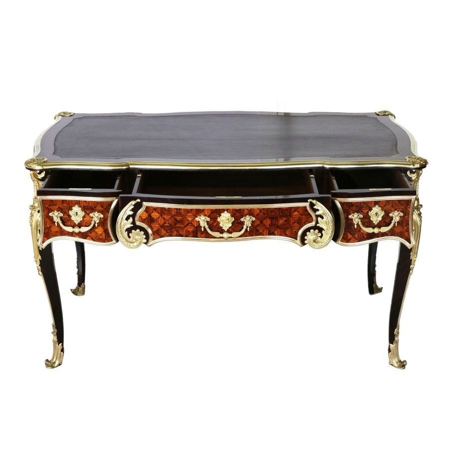 Antique Magnificent writing desk in wood and gilded bronze, Louis XV style.