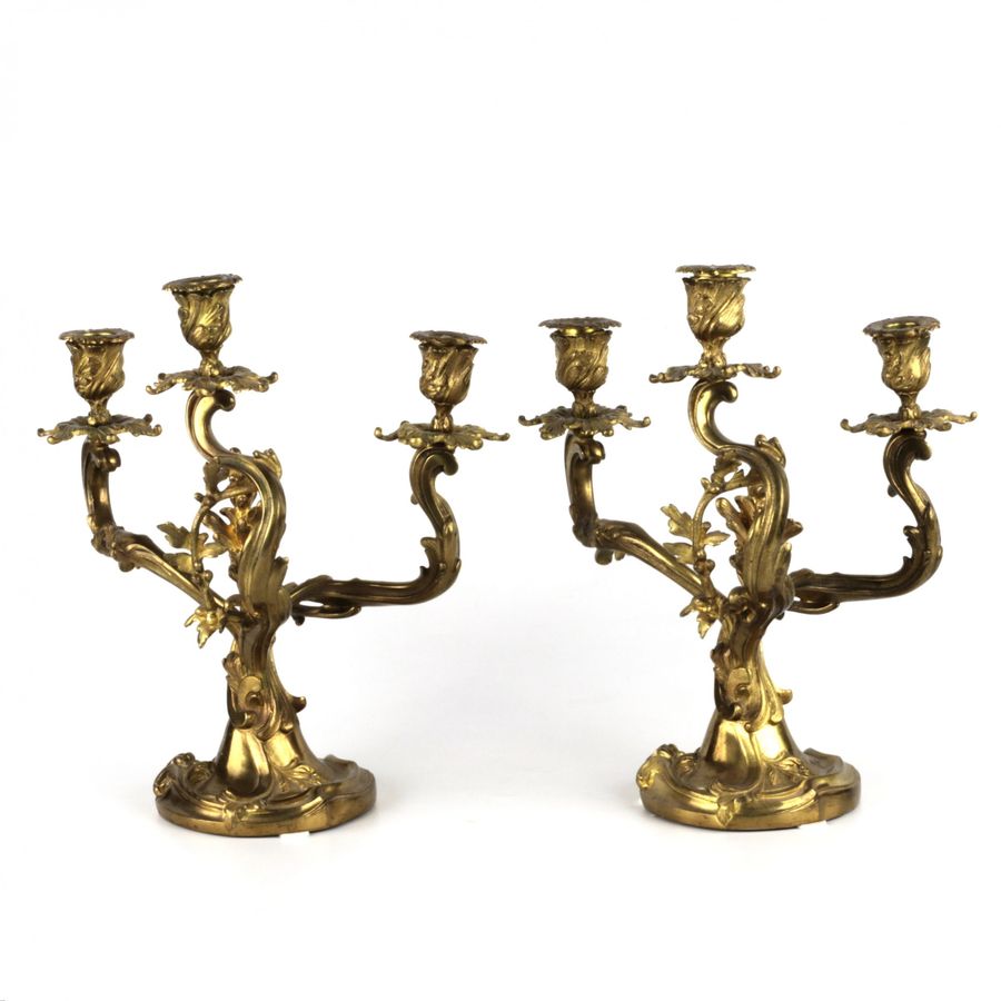 Antique Pair of gilded bronze rocaille candelabra.