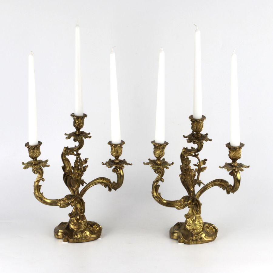 Antique Pair of gilded bronze rocaille candelabra.