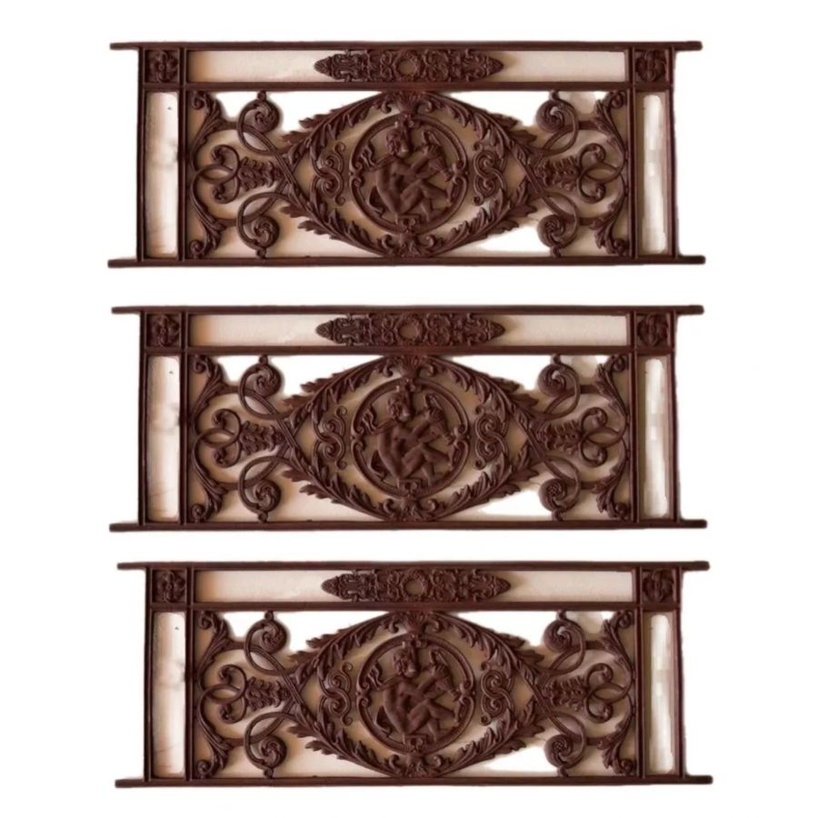 Three cast-iron balcony gratings