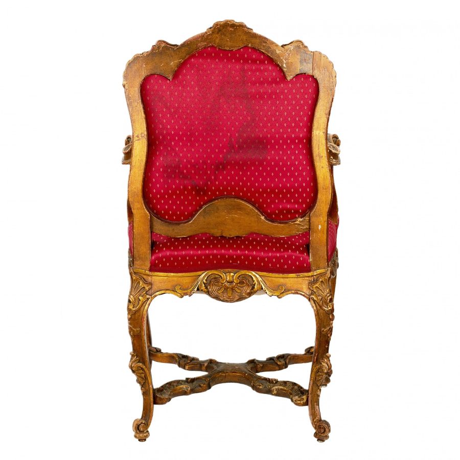 Antique Magnificent, carved chair in the Rococo style of the 19th-20th centuries.