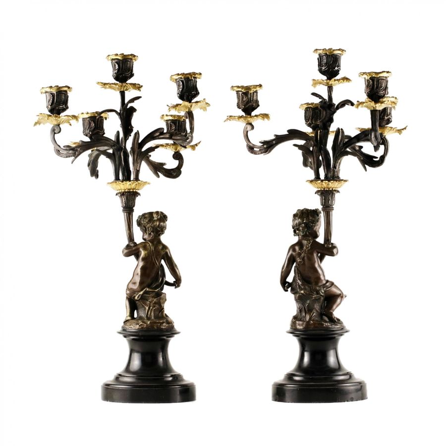 Antique A pair of bronze candlesticks in the Baroque style. 19th century.