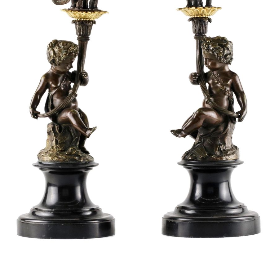 Antique A pair of bronze candlesticks in the Baroque style. 19th century.