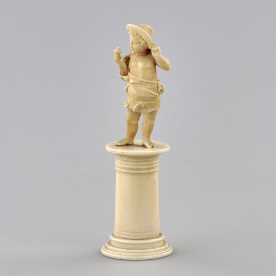 Antique Carved ivory figurine of a boy with a bird 1800s.