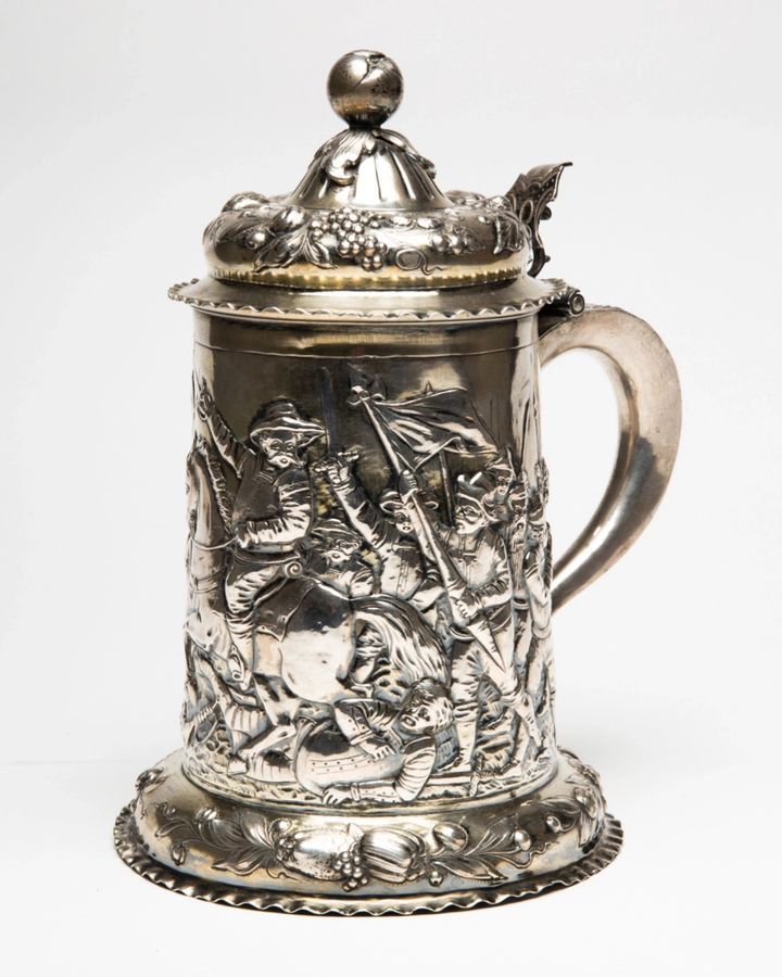 Antique Silver beer goblet with battle scenes. First half of the 19th century.