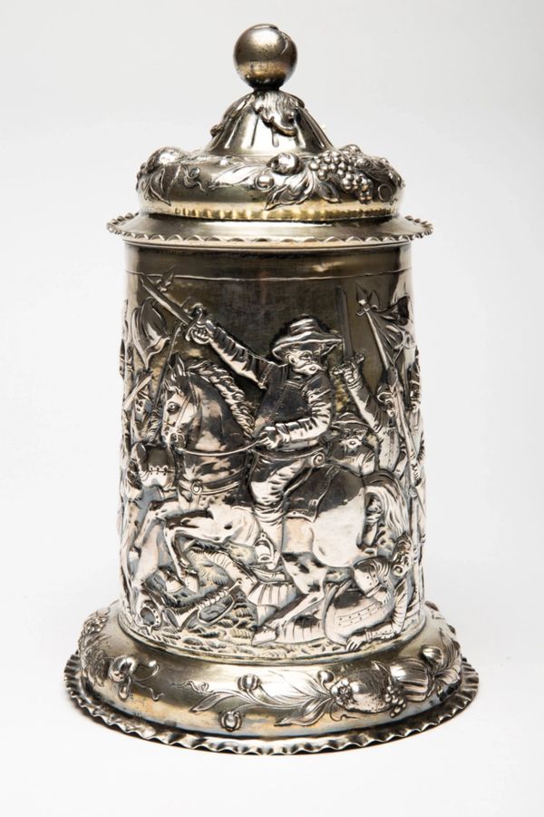 Antique Silver beer goblet with battle scenes. First half of the 19th century.