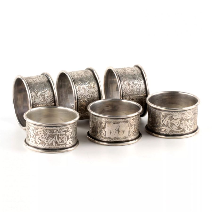 Antique Six English silver napkin rings, in an original case.