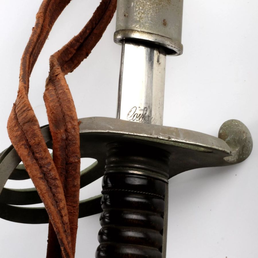 Antique Shaped sword with a steel hilt and scabbard.