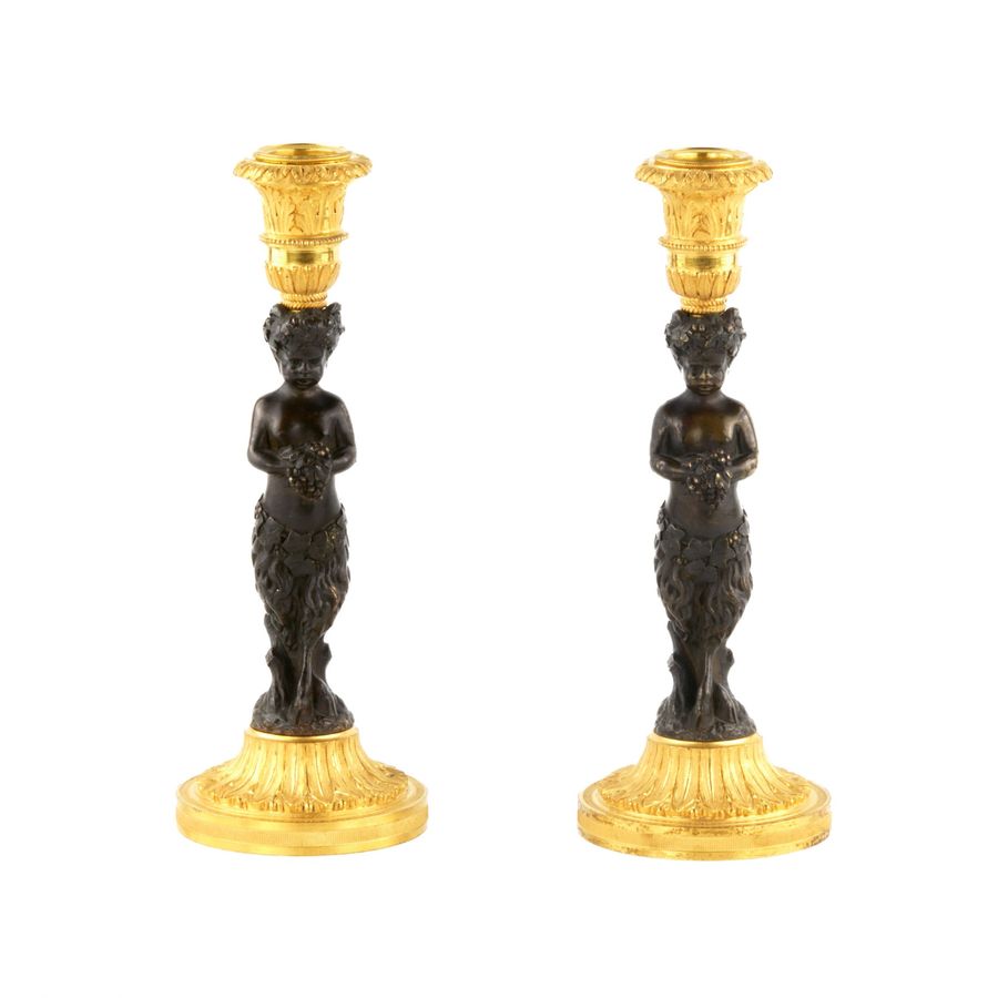 Pair of bronze, French candlesticks, in the form of fauns, mid-19th century.