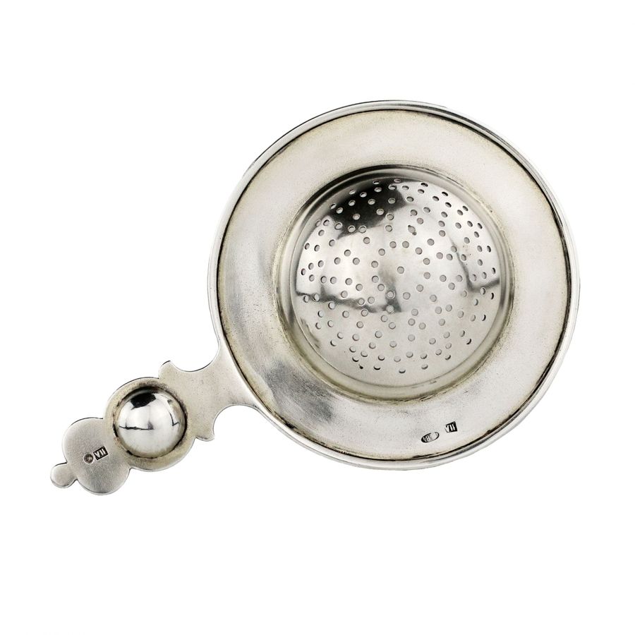 Antique Russian silver tea strainer, with enamel decor, in the spirit of Russian Art Nouveau.