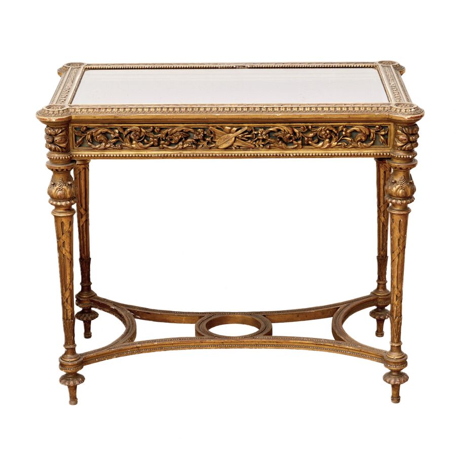 Antique Carved showcase-table of gilded wood, in the spirit of Napoleon III, late 19th century.