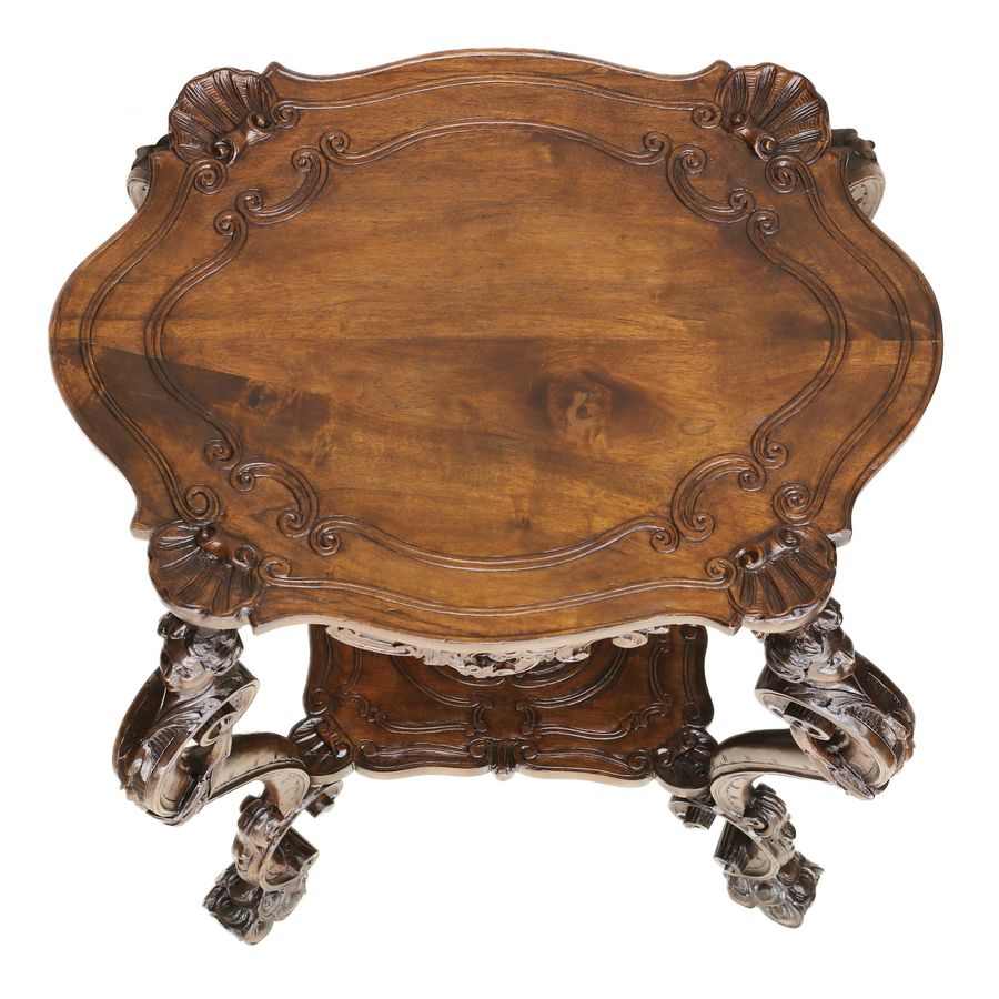 Antique Carved wooden table in neo-Rococo style from the turn of the 19th century.