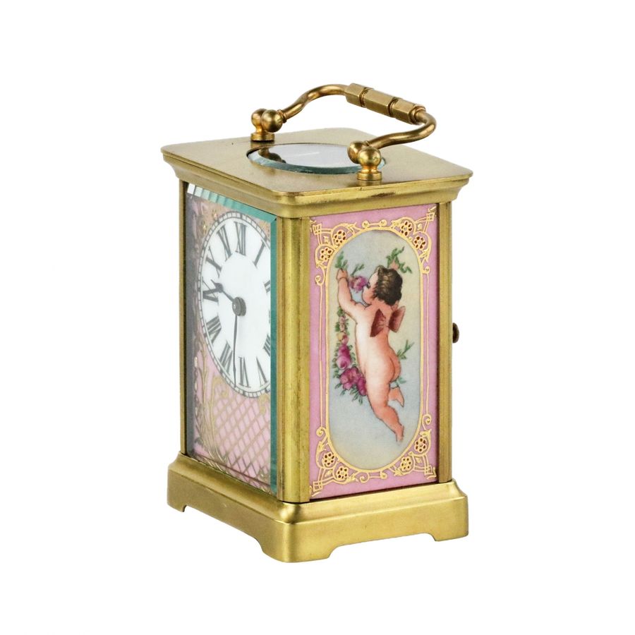 Antique French carriage clock with porcelain painting, neo-rococo style. The turn of the 19th-20th centuries.