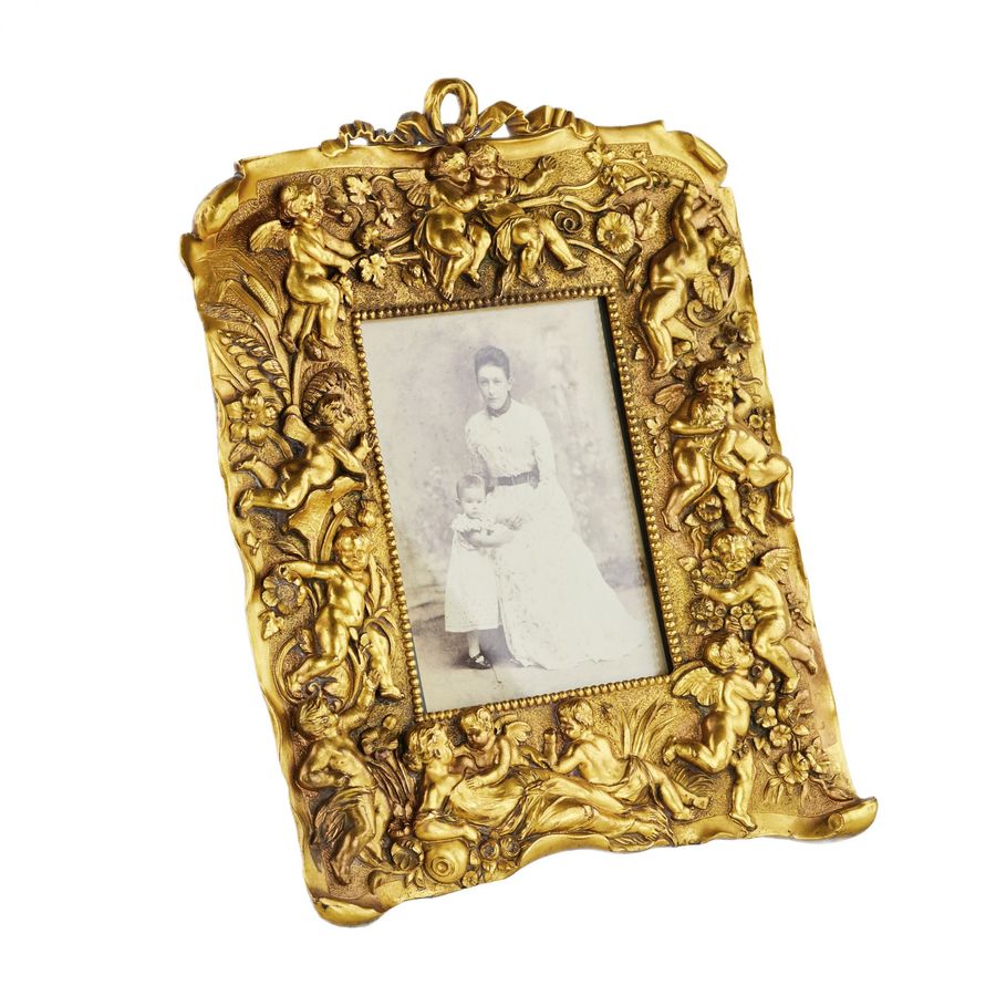 Antique Non-trivial photo frame of gilded bronze in the Neo-Baroque style, the turn of the 19th-20th centuries.