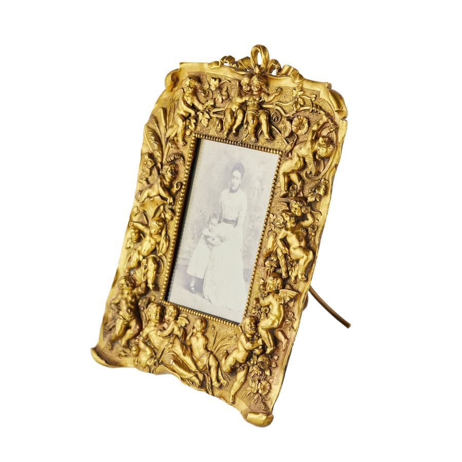 Antique Non-trivial photo frame of gilded bronze in the Neo-Baroque style, the turn of the 19th-20th centuries.