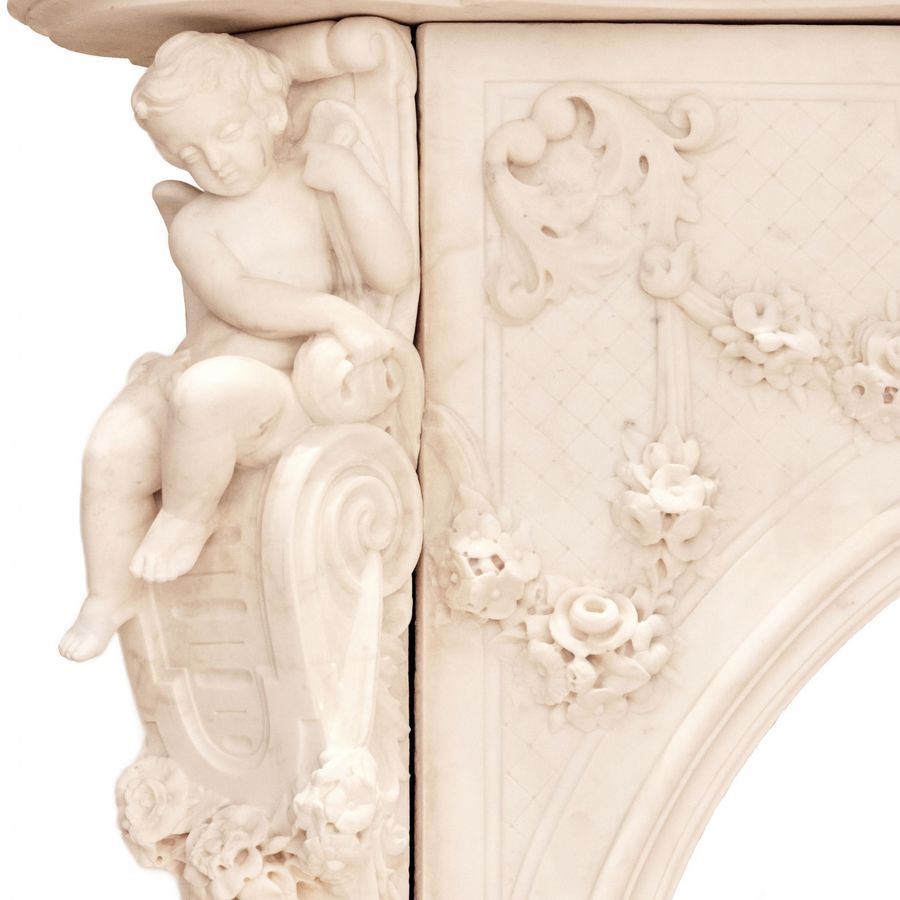 Antique French white marble fireplace with cupids, Louis XV style. 19th century