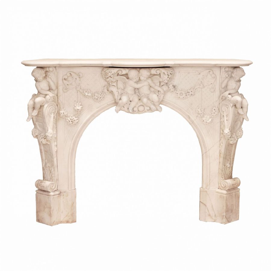 Antique French white marble fireplace with cupids, Louis XV style. 19th century