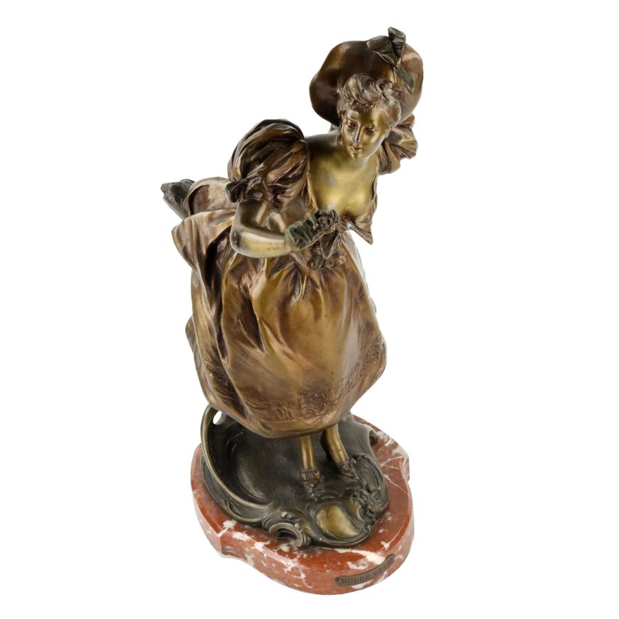 Antique French, bronzed metal figure on a marble base. Happy holiday.