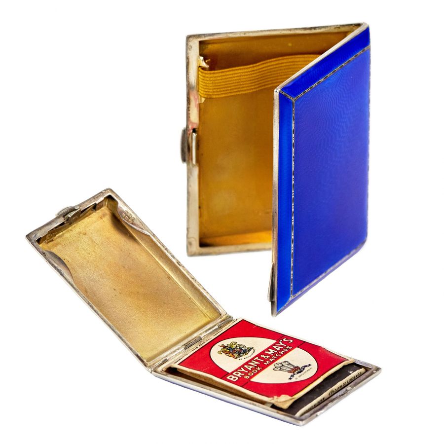 Antique English smoking set of cigarette case and matchbox made of silver and enamel.