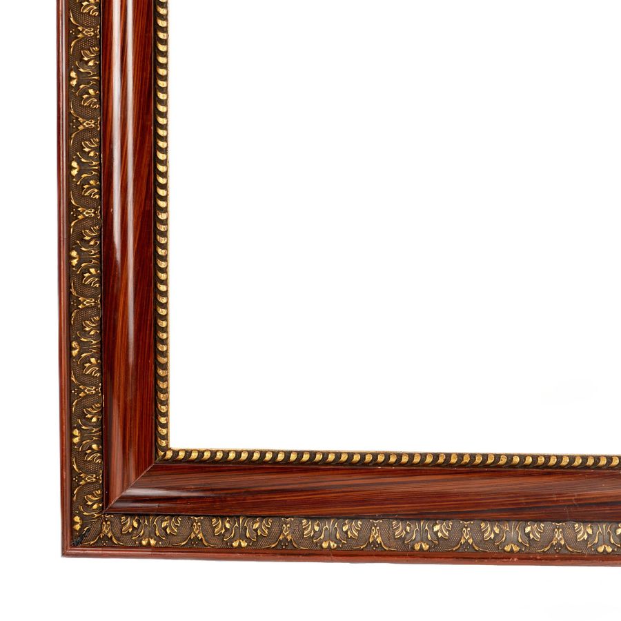 Antique Paired frames of polished wood with bronze decoration of acanthus and cord. 20th century.