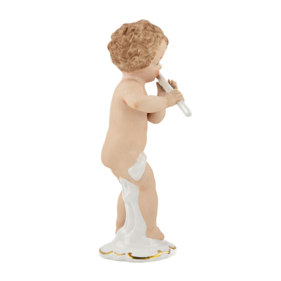 Antique Porcelain figurine Boy with a flute. Wallendorf, Germany, mid-twentieth century.