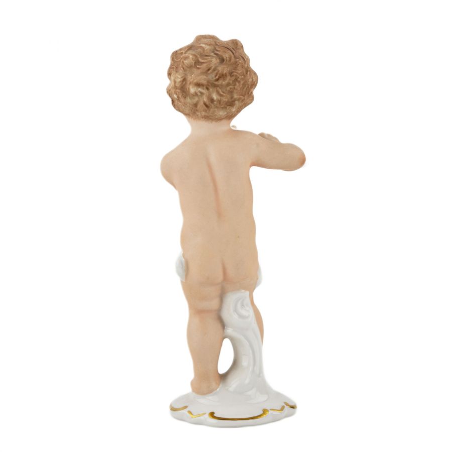 Antique Porcelain figurine Boy with a flute. Wallendorf, Germany, mid-twentieth century.