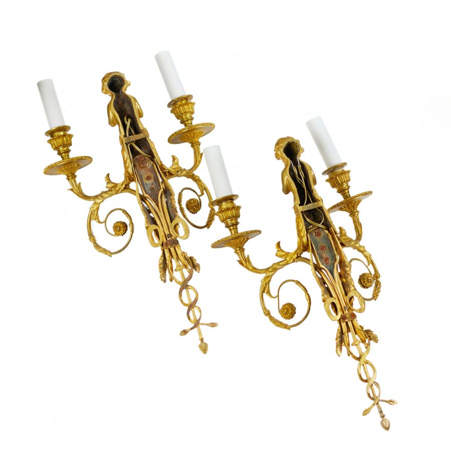 Antique Pair of French gilt bronze sconces, Louis XVI style, 19th century.