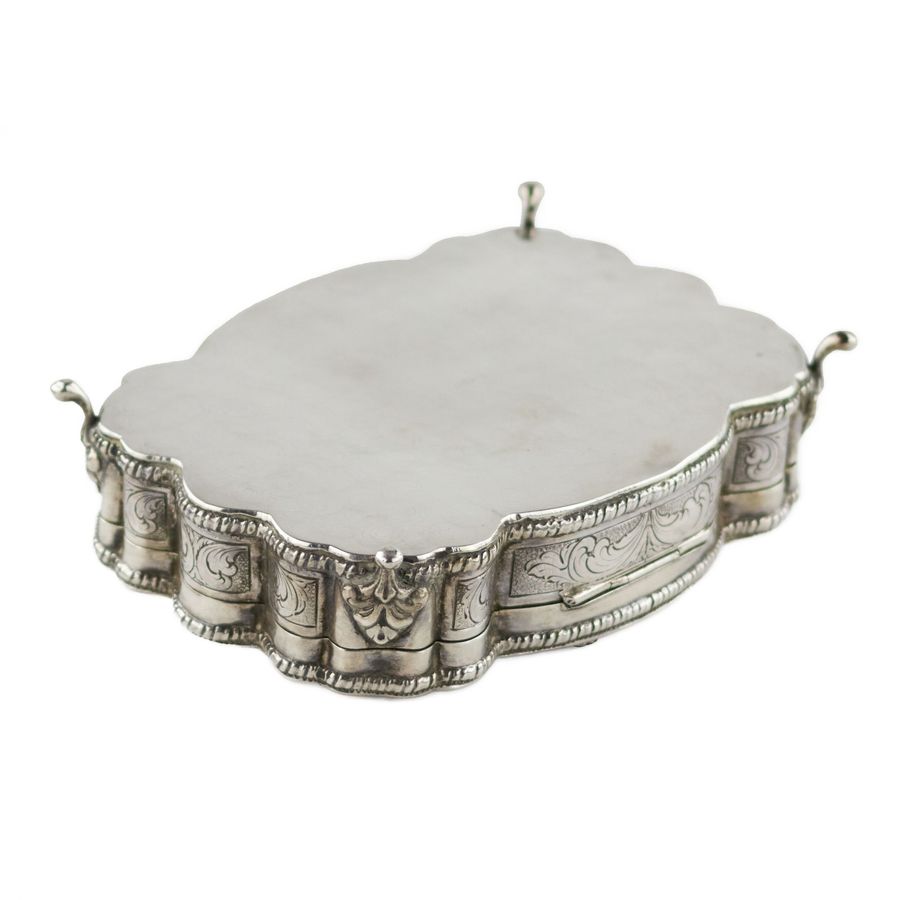 Antique Italian, silver jewelry box of baroque shape. 20th century.