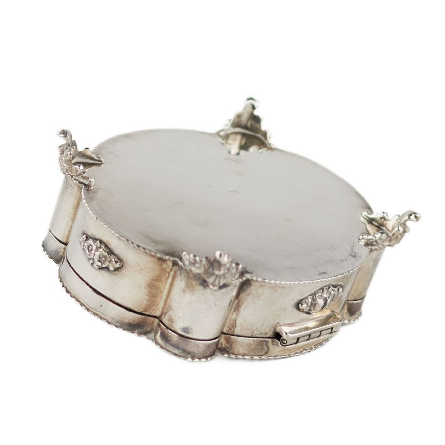 Antique Italian, silver jewelry box of baroque shape. 20th century.