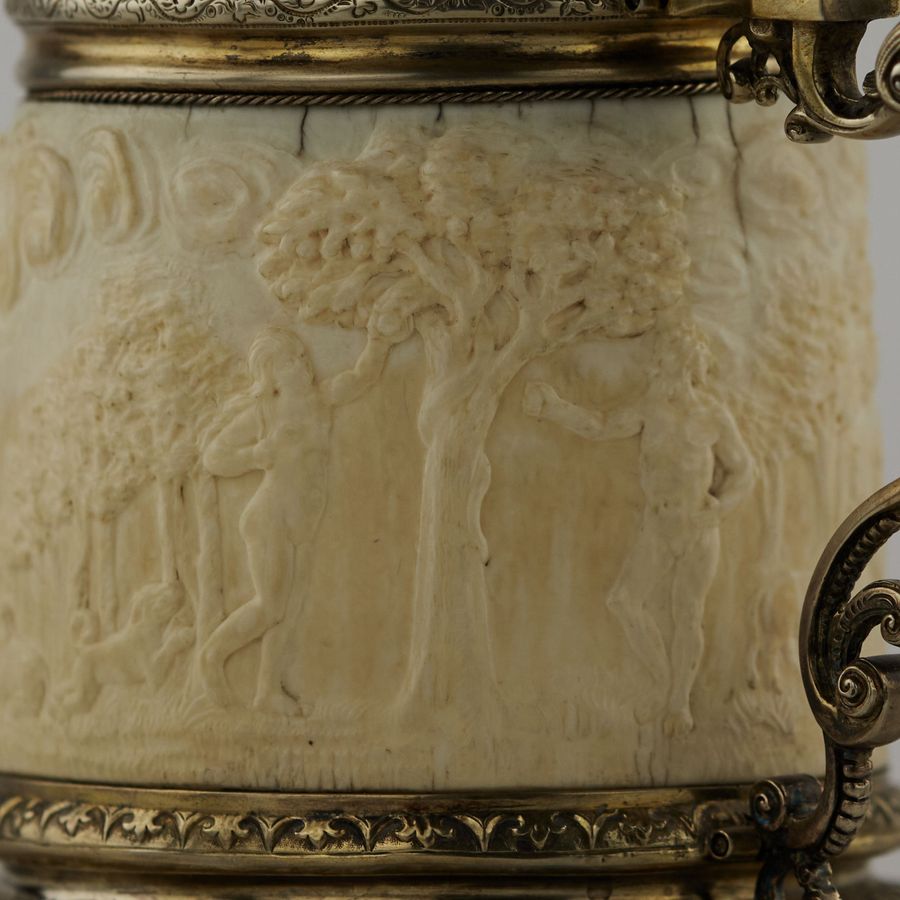 Antique Silver beer goblet with Atlas on the lid and religious scenes on ivory. Lubeck. 17th century.