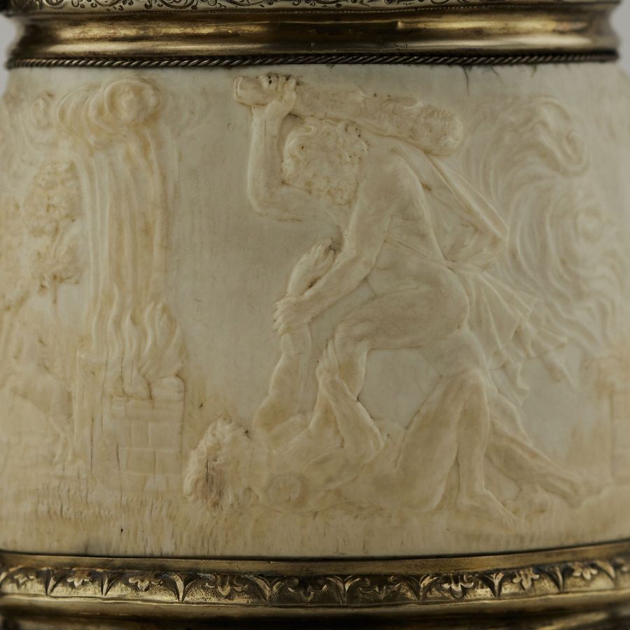 Antique Silver beer goblet with Atlas on the lid and religious scenes on ivory. Lubeck. 17th century.