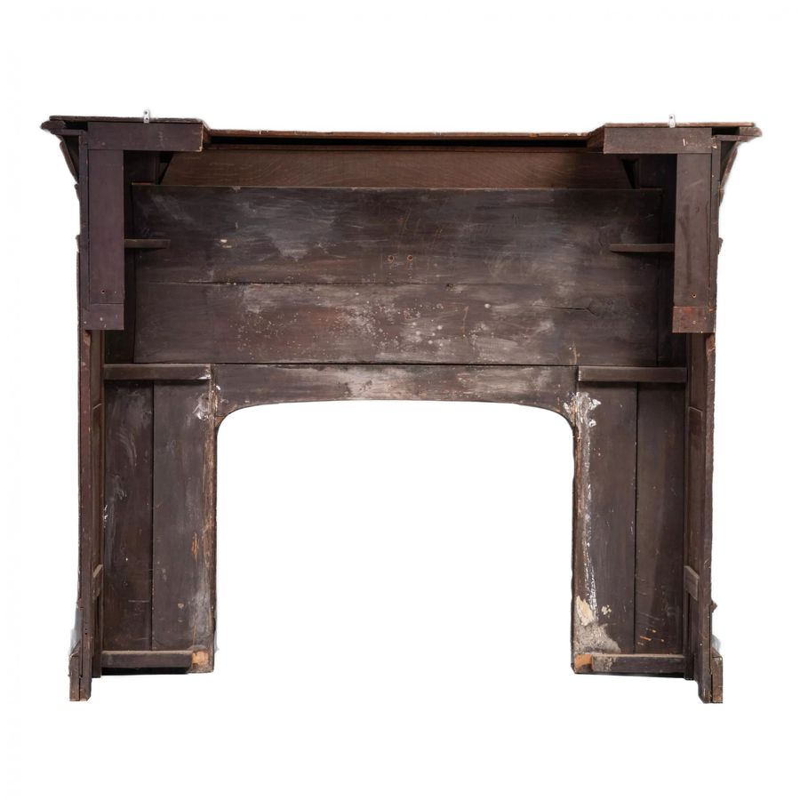 Antique Carved oak fireplace in Renaissance style.