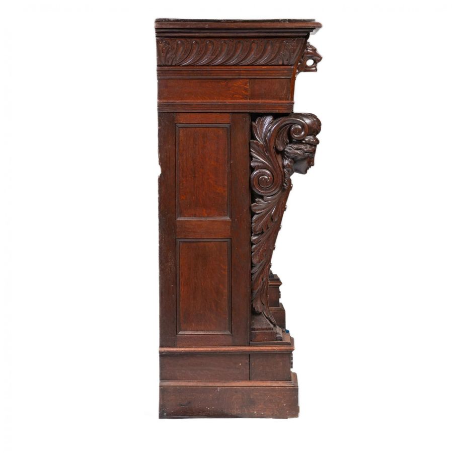 Antique Carved oak fireplace in Renaissance style.