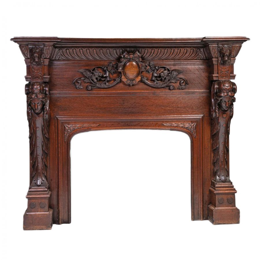 Antique Carved oak fireplace in Renaissance style.