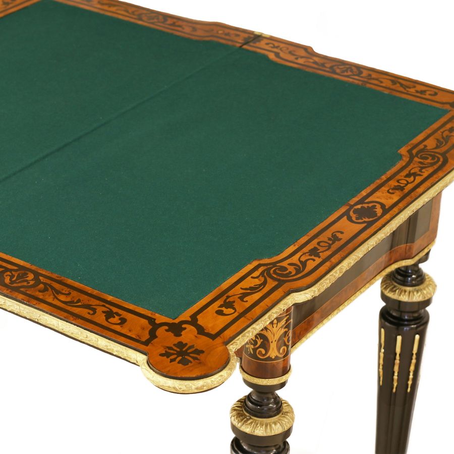 Antique Gaming table decorated with a pattern using marquetry technique. France. Late 19th century