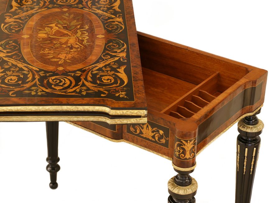 Antique Gaming table decorated with a pattern using marquetry technique. France. Late 19th century