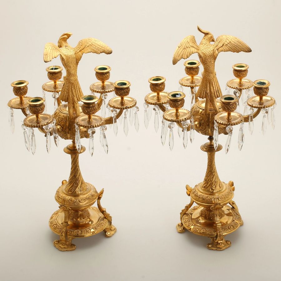 Antique Pair of candelabra with figures of birds of paradise.